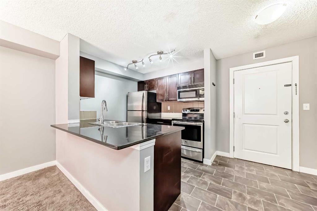 Picture of 4304, 403 Mackenzie Way SW, Airdrie Real Estate Listing
