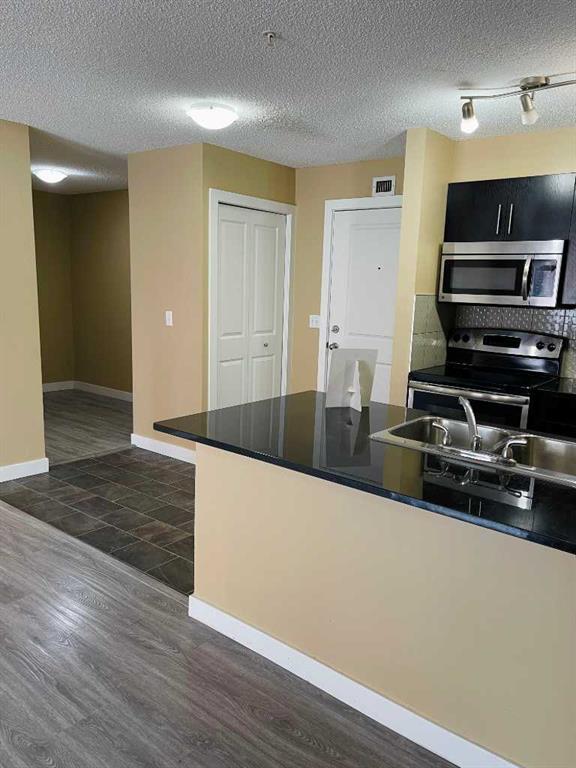 Picture of 6210, 403 Mackenzie Way SW, Airdrie Real Estate Listing