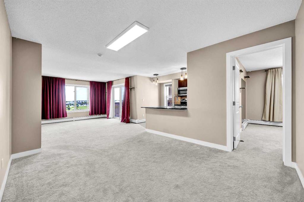 Picture of 7411, 403 Mackenzie Way SW, Airdrie Real Estate Listing