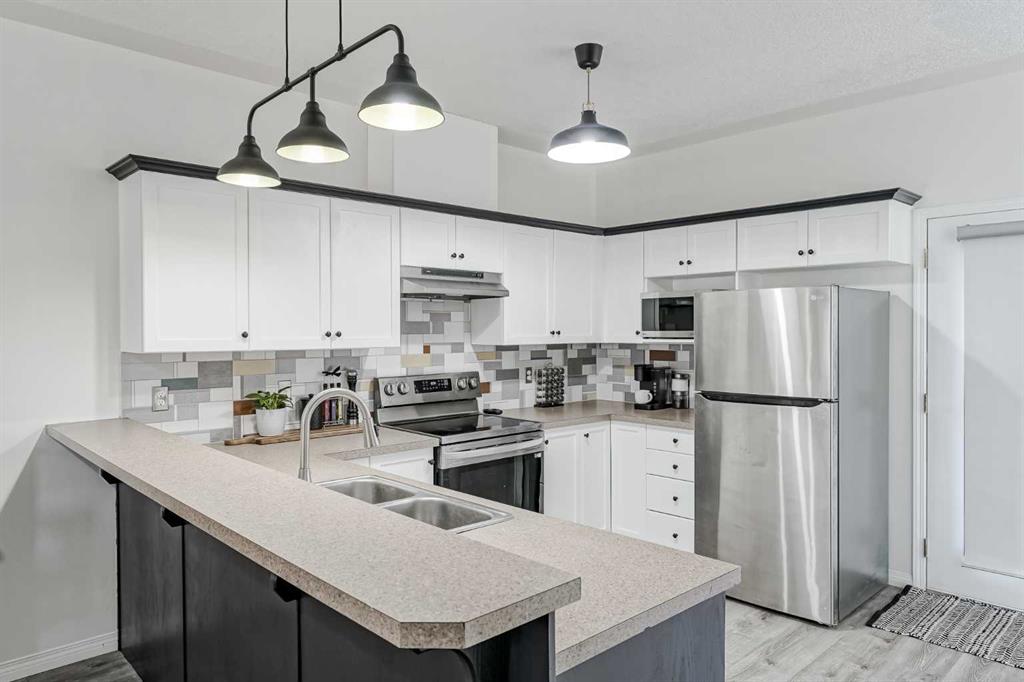 Picture of 703, 2001 Luxstone Boulevard SW, Airdrie Real Estate Listing